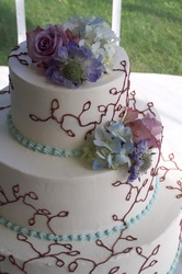 Chocolate vines on buttercream wedding cake.  Carboro, NC
