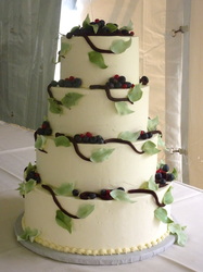Fresh berries and sugar leaves on buttercream wedding cake.
Chapel Hill, NC