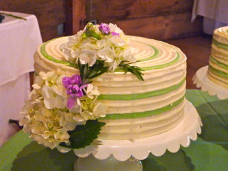 Bi-color lines on buttercream wedding cake. Hat wedding cake.
Durham, NC